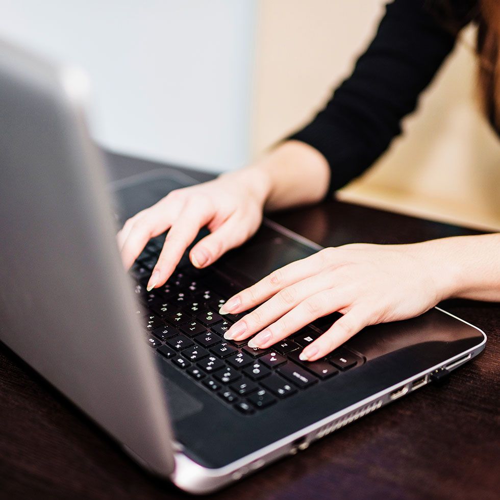 woman typing laptop
